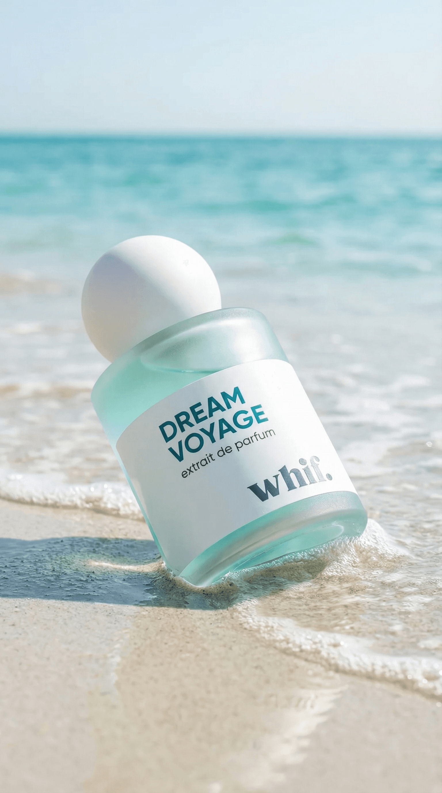 Turquoise Dream Voyage perfume bottle standing in shallow ocean water